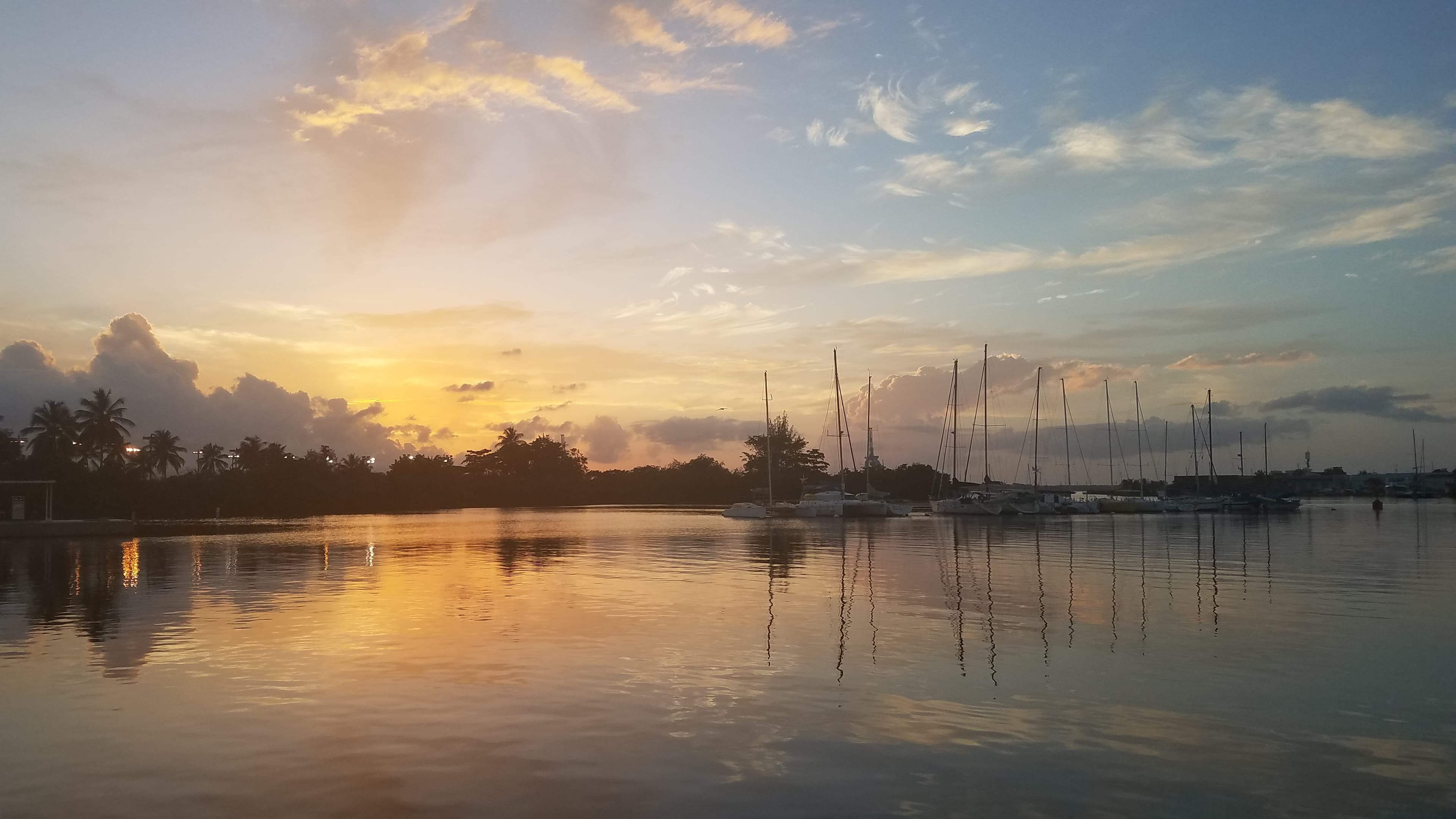 Golden sunset over Caribbean harbor
