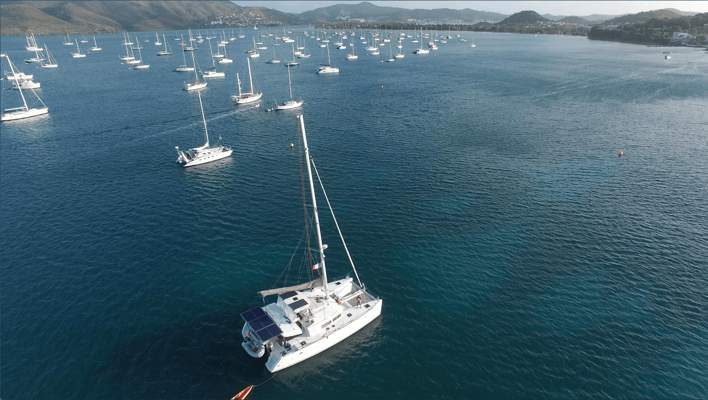 Ad Astra anchored in a turquoise Caribbean harbor