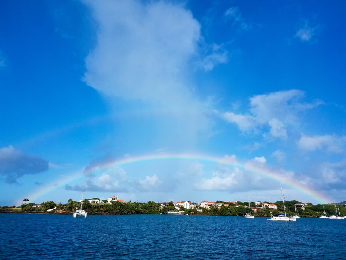 Rainbow over sailboat anchorage